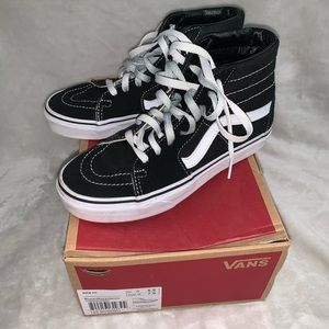 Black and white high top vans